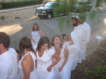 Jewish teens dressed in white.